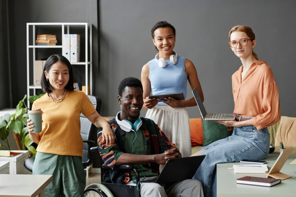 Inclusive diverse business team posing together in office